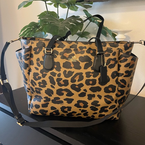 cheetah print coach backpack Mini Court In Signature Canvas With Leopard Signature coated canvas printed coated canvas and refined pebble leather Inside zip and multifunction pockets Double zip closure fabric lining Handle with 1 1/2 drop Outside zip and open pockets Adjustable shoulder straps 7 3/4 (L) x 8 3/4 (H) x 3 1/2 (W) Style No. Coach Leopard Back Pack Court